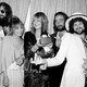 Members of the singing group Fleetwood Mac pose with their award at the American Music Awards show in Santa Monica, Ca., Jan. 16, 1978. The group was named favorite pop group and "Rumours" was named favorite album in the pop category. Posing from left are, Mick Fleetwood, wearing sunglasses; Stevie Nicks; Christine McVie; John McVie; and Lindsey Buckingham. (AP Photo/Nick Ut)